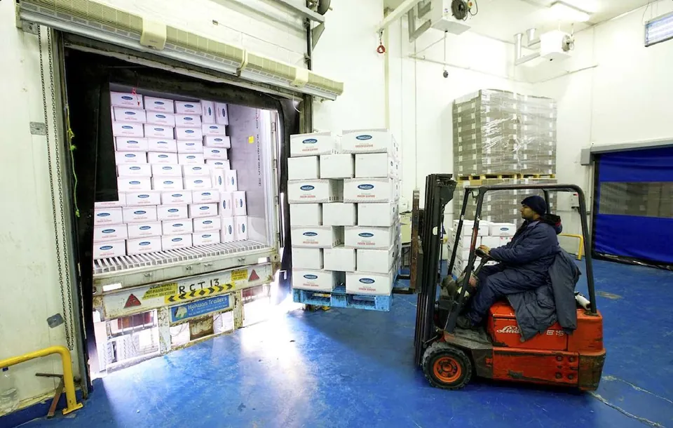 Packed seafood being loaded into a vehicle at the loading bays